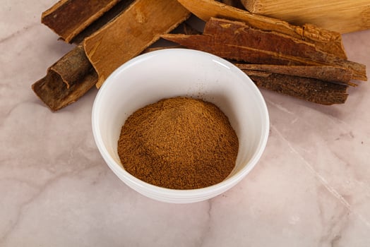 Natural Cinnamon powder with sticks photo