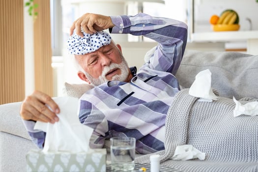 New coronavirus CoVid-19 outbreak situation with pandemic epidemic warning - adult caucasian senior old man with fever symptoms like illness cold seasonal influenza - people and virus concept photo