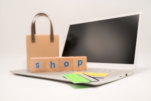 Brown bag shopping putting on computer photo