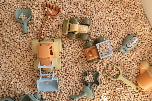 A modern children's sandbox with toys. Sandbox filler in the form of wooden small wooden cubes photo