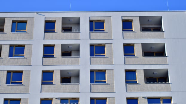 Modern architecture of urban residential apartment building. Apartment building exterior, residential house facade. photo