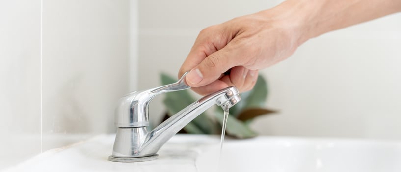 Save water. Volunteer keeps turning off the running water in the bathroom to protect environment. Greening planet, reduce global warming, Save world, life, future, risk energy, crisis , water day. photo