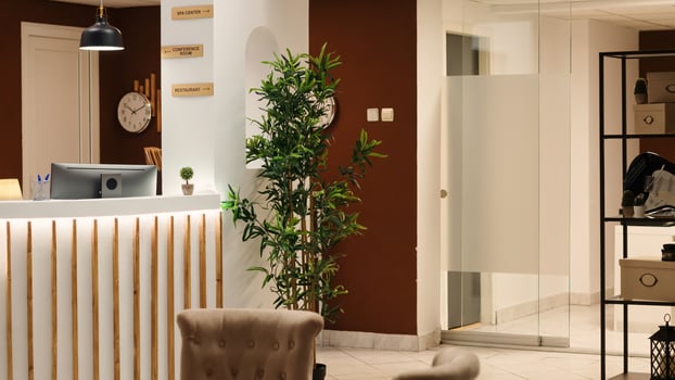 Empty business hotel lounge interior with luxurious deluxe conference room, spa center and restaurant amenities. Cozy warm stylish resort lobby waiting for arriving guests photo