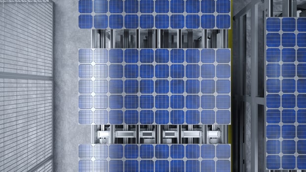 Top view of solar panel assembly line operated by high tech robot arms in modern sustainable factory. Aerial shot of photovoltaics production process taking place in automated facility photo