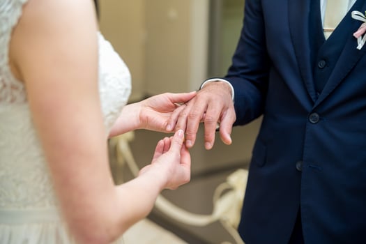 Wedding rings. The bride wears a wedding ring on the groom photo