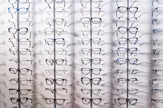 Row of luxury eyeglass at an opticians store. Gglasses background photo