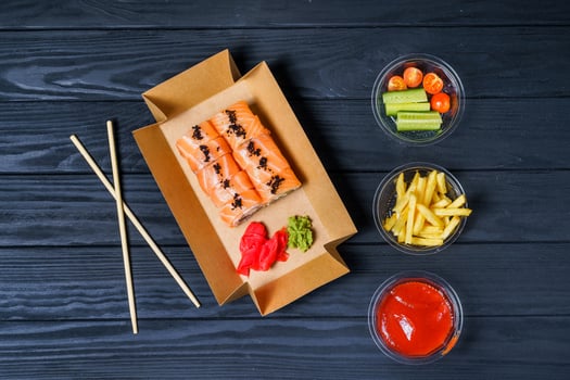 Food delivery, sushi rolls. Set of sushi in a cardboard box. Fast food photo