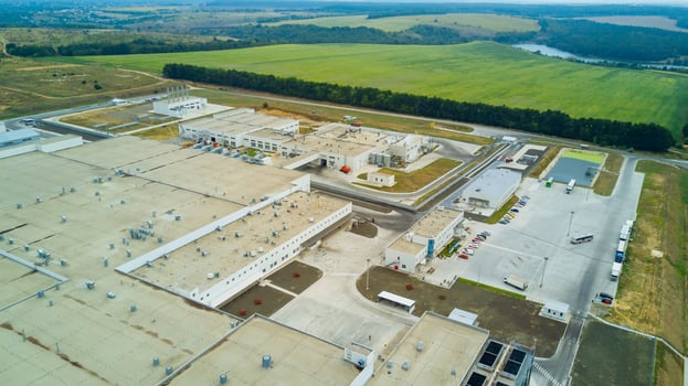 Aerial view of stylized altered generic modern industrial building. photo
