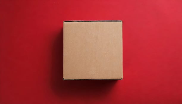 Brown closed cardboard boxes on red backdrop. Craft eco package. Flat lay photo