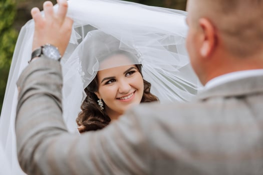 Wedding couple on a walk in the autumn park. The bride in a beautiful white dress. Love and relationship concept. Groom and bride in nature outdoors photo