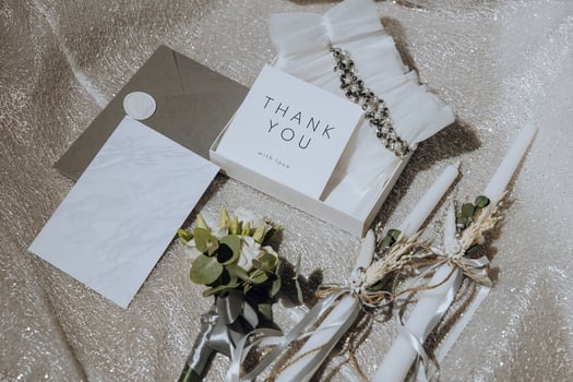 Bride's wedding ring on high-heeled shoes, women's perfume, wedding glasses. Wedding details. High quality photo