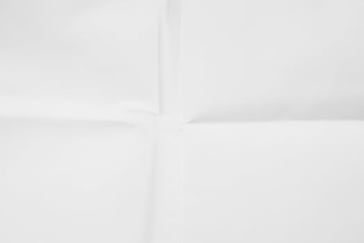 White sheet of paper folded texture photo