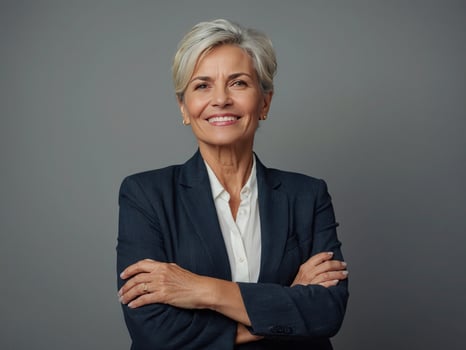 AI generated Beautiful middle age senior business woman over isolated background with crossed arms photo