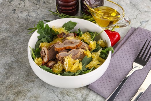 Salad with roasted duck and orange photo