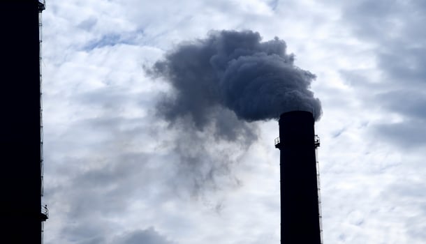 Chimneys of industrial plant contaminated air with toxic smoke photo