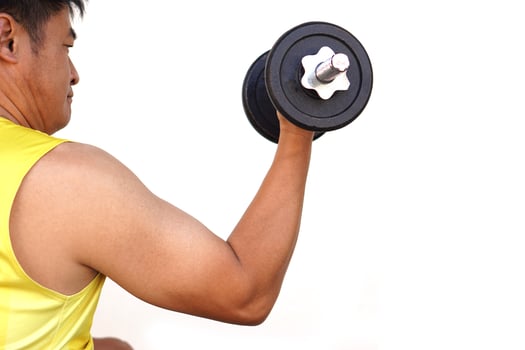 Close up man lifts dumbbell isolated on white background. Concept, sport equipment. Exercise for health bodybuilding. Strengthen muscle. Weight lifting. Healthy lifestyle. photo