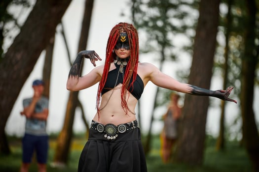 Mythological dancing girl faun on green lawn in public park outdoor art dancing event photo