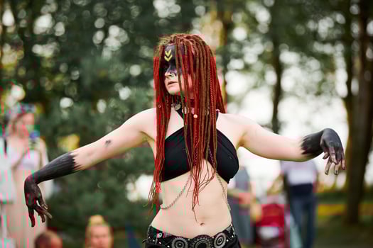Mythological dancing girl faun on green lawn in public park outdoor art dancing event photo