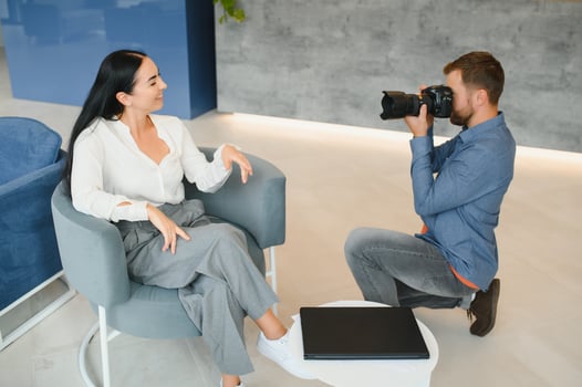 Young beautiful model posing for professional photographer in studio. photo