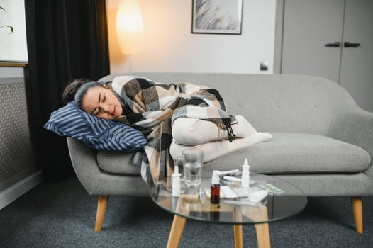 Young ill woman in bed at home. photo