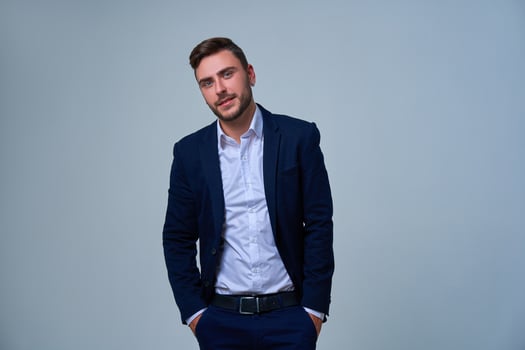 Close up portrait young man businessman. Caucasian guy business suit studio gray background. photo