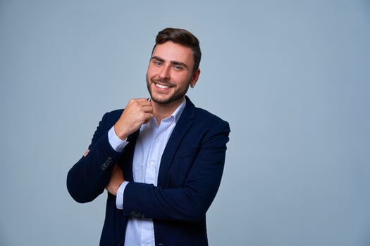 Close up portrait young man businessman. Caucasian guy business suit studio gray background. photo