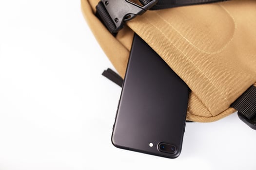 Beige bag on a white isolated background with a hidden pocket for a mobile phone photo