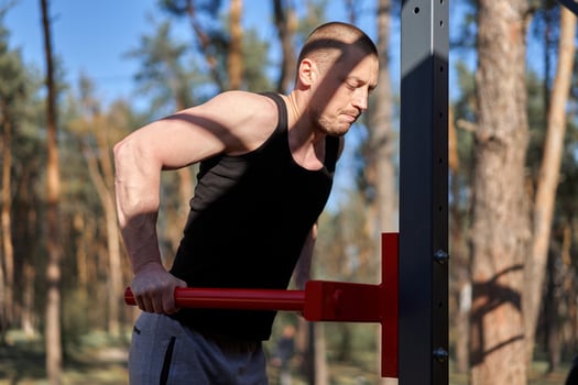 Handsome caucasian men push up outdoor workout cross training morning Pumping triceps arm exercising sports ground photo