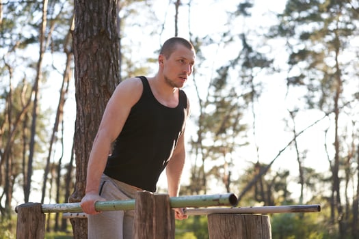 Handsome caucasian men push up outdoor workout cross training morning Pumping triceps arm exercising sports ground photo
