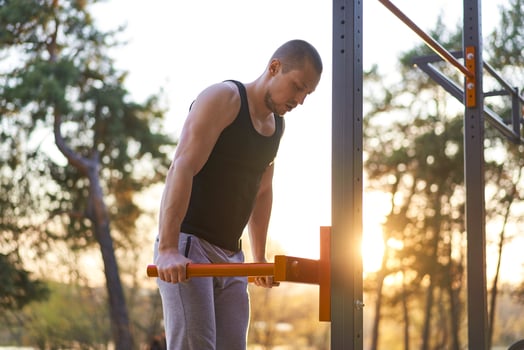 Handsome caucasian men push up outdoor workout cross training morning Pumping triceps arm exercising sports ground photo