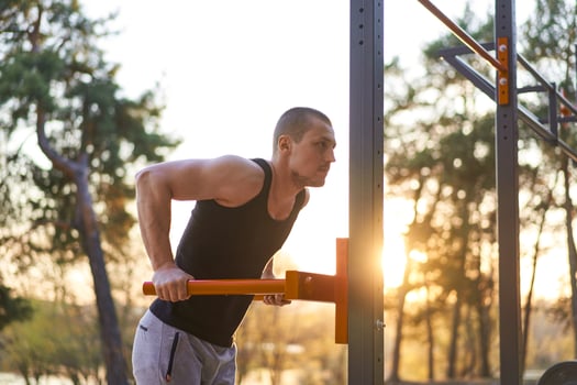 Handsome caucasian men push up outdoor workout cross training morning Pumping triceps arm exercising sports ground photo