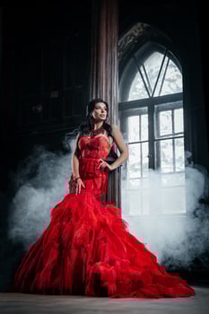 Woman Vintage Red Dress Old Castle Beautiful Princess In Seductive Dress photo