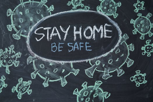 Hashtag stay at home. Outbreak Warning. written white chalk on blackboard in connection with epidemic of coronavirus worldwide. photo