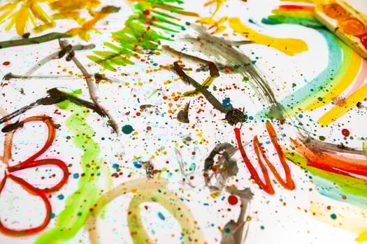 Children's drawing in colorful colors. Close, top view. Children's entertainment, family leisure photo
