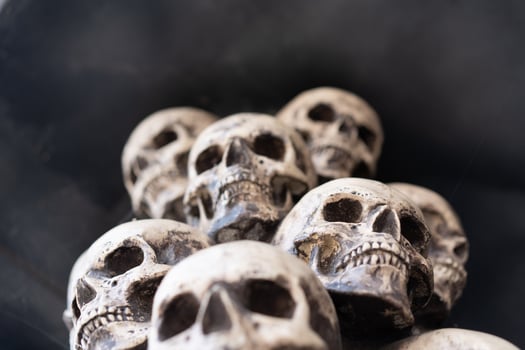 Skull Halloween Background Many People Skulls Stand on top of each other. Mystic creepy concept. Abstract nightmare occult memorial photo