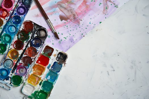Set of watercolor paints on white background. Brushes drawing. Creative background. School for teaching drawing. photo