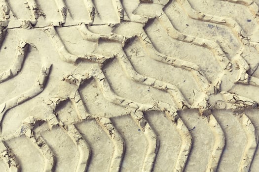 yellow texture tire tracks close up on the sand photo