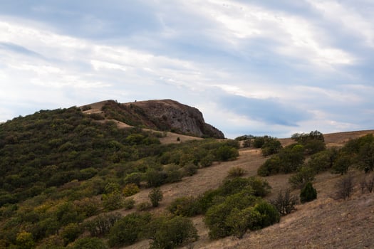 mountain peak with greenery on the sky background photo