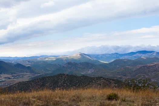 mountain peak with greenery on the sky background photo