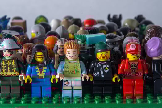 Lego mini figures set of different. Game toy man. Children's game constructor bricks. Crowd of friends. Ukraine, Kyiv - January 17, 2024. photo