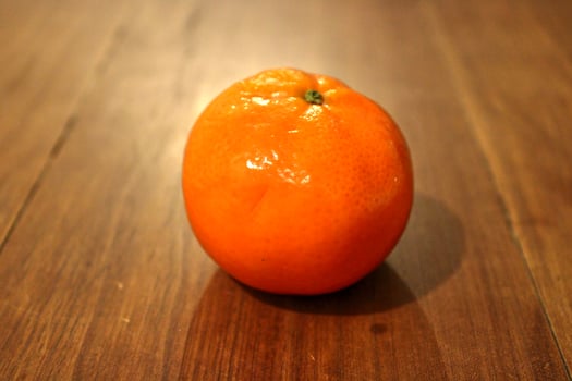 tangerine on an table, tropical fruit photo