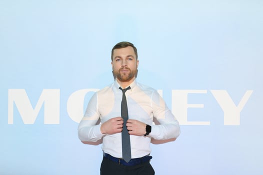 Concept of success in business. Businessman on the background of the word MONEY. photo