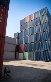 Containers stacked in a freight terminal at the port of Bangkok, Thailand photo