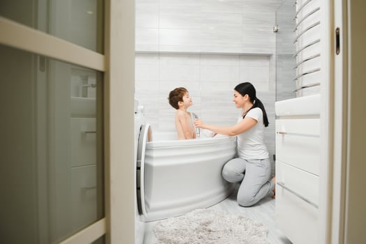 Mother And Son Having Fun At Bath Time Together photo