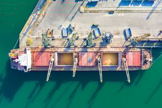 Aerial view from a drone of a large ship loading grain for export. Water transport photo