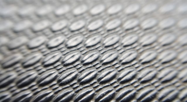 a silver snake skin as a background. Macro. photo