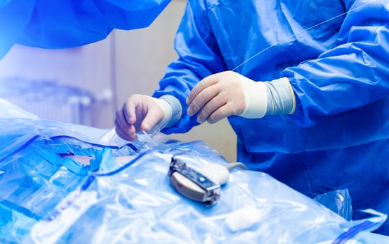 Spinal surgery. Group of surgeons in operating room with surgery equipment. Laminectomy. Modern medical background photo
