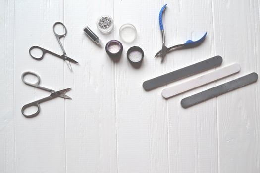 Tools for manicure. Manicure scissors on the white background. photo