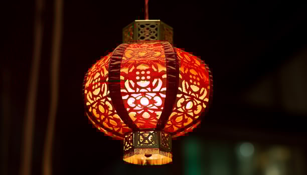 AI generated Chinese lanterns hanging in the night, illuminating traditional celebrations generated by AI photo