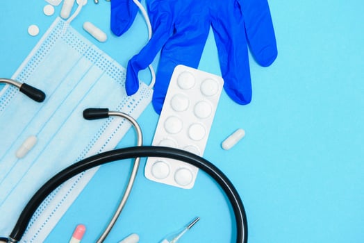 Medical background with with statoscope and pills. concept pharmacy, clinic, drugs, headache medicine. Image on illness, cardiology, treatment. photo